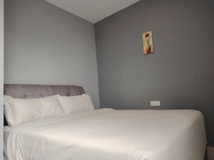 G9 Hotel Alor Setar客房内的一张或多张床位