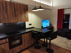 a kitchen with a desk with a computer on it at Sierra Nevada El Tesoro in Sierra Nevada