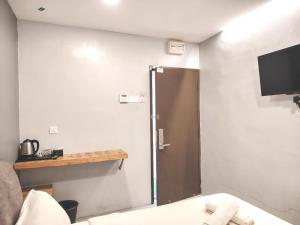 G9 Hotel Alor Setar的电视和/或娱乐中心
