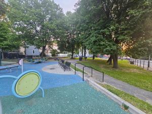 a park with benches and a mirror on the ground at Brand New 4BR House 20Min Downtown Boston in Boston
