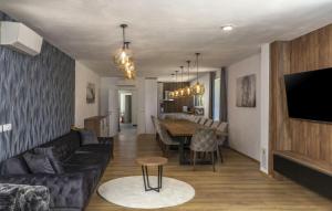 a living room with a couch and a table at Beautiful Villa Magica in Opatija in Mošćenička Draga