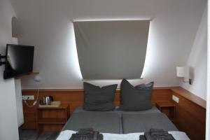 Postel nebo postele na pokoji v ubytování Burghotel - Das Original