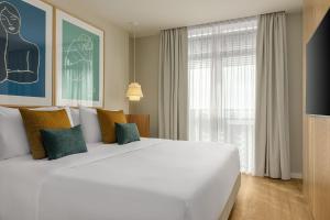 A bed or beds in a room at AC Hotel Gava Mar