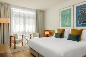 A bed or beds in a room at AC Hotel Gava Mar