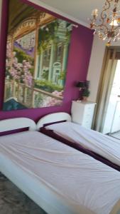 Łóżko lub łóżka w pokoju w obiekcie Moderne Appartement Cannes Californie