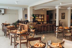 A restaurant or other place to eat at Neevana Hotel Hikkaduwa