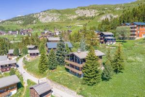 an aerial view of a resort with trees and buildings at Chalet Rübezahl Attika in Riederalp