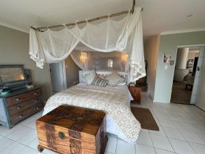 En eller flere senge i et værelse på Umdloti Cottage on 5th Avenue + 9 billeder