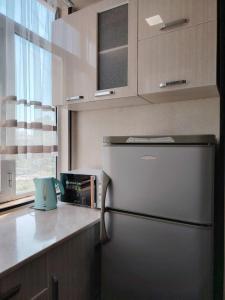 Η κουζίνα ή μικρή κουζίνα στο Apart Tashkent