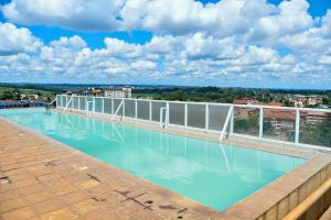a swimming pool on the roof of a building at Mex Homes Studio in Nairobi