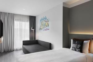 Posteľ alebo postele v izbe v ubytovaní Moxy Barcelona