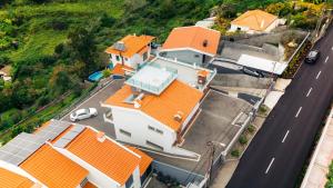 an overhead view of a house with orange roofs at Atlantic View Residence in Funchal