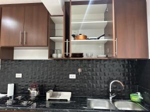 Kuchyň nebo kuchyňský kout v ubytování Chuflay Apartments, Barrio El Molino pleno centro Tarijeño + 6 fotografií