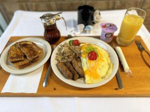a tray with two plates of breakfast food on a table at The Hudson Inn in Morris