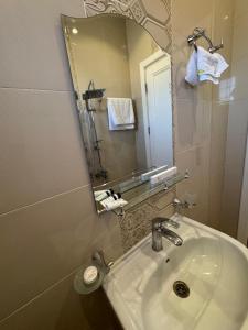 Koupelna v ubytování New Time Apartments + 19 fotografií