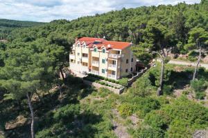 an aerial view of a large house in the woods at Villa Vista Jelsa in Jelsa