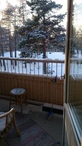 a room with a snow covered porch with a vacuum at Apartment Haltijantie in Kotka