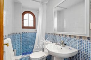 a bathroom with a sink and a toilet and a mirror at South Facing Garden Holiday in Heated Pool Complex FC715 - 2xSt in San Miguel de Abona +13 photos