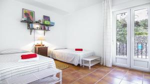 Ένα ή περισσότερα κρεβάτια σε δωμάτιο στο Casa la Pita de los Genoveses +12 φωτογραφίες