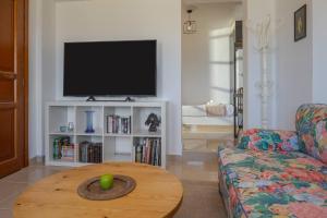TV a/nebo společenská místnost v ubytování Ascuri Apartment