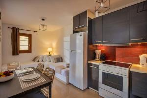 Kuchyň nebo kuchyňský kout v ubytování Ascuri Apartment
