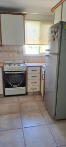 O bucătărie sau chicinetă la Departamento cómodo y acogedor
