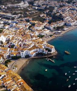 an aerial view of a beach with buildings and the water at Casas del Mar in Cadaqués
