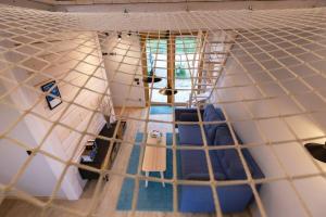 an interior view of a yurt with a net at Modern Svencelė Cottage I-Friends and Family in Svenele
