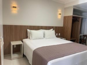 Cama ou camas em um quarto em Hotel Jardim