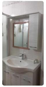 a bathroom with a sink and a mirror at Casa del Viandante in Nichelino