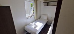 Postel nebo postele na pokoji v ubytování Mobile Home dans Camping 4 étoiles