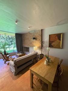 a living room with a couch and a table at Parque Juan Diego in Guadalajara