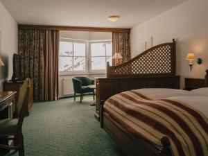 Posteľ alebo postele v izbe v ubytovaní Alpenhotel St.Christoph