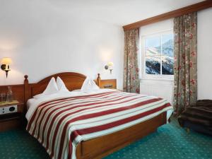 Posteľ alebo postele v izbe v ubytovaní Alpenhotel St.Christoph