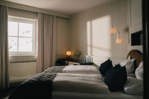 Posteľ alebo postele v izbe v ubytovaní Alpenhotel St.Christoph