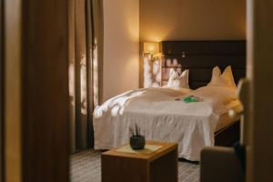 Posteľ alebo postele v izbe v ubytovaní Alpenhotel St.Christoph