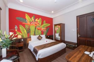 Postel nebo postele na pokoji v ubytování Jade Hotel