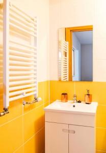 a bathroom with a sink and a mirror at 9Arches in Vila Nova de Poiares