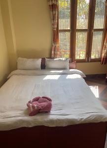 Rúm í herbergi á Tara guesthouse - Sauraha,Chitwan