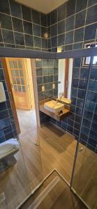a bathroom with a sink and a mirror at Hotel Barra da Ferrugem Eco Village in Garopaba