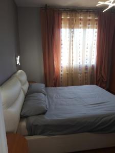 Ένα ή περισσότερα κρεβάτια σε δωμάτιο στο Attico Sweet Home Vitinia Roma