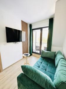 Μια τηλεόραση ή/και κέντρο ψυχαγωγίας στο Lexi Green Hills apartman