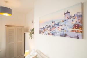 a painting on a wall in a room at Host & Stay - Harbour Lights in Ramsgate +3 photos