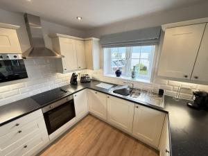 Η κουζίνα ή μικρή κουζίνα στο New England Cottage