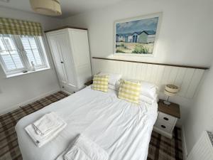 Ένα ή περισσότερα κρεβάτια σε δωμάτιο στο New England Cottage +45 φωτογραφίες