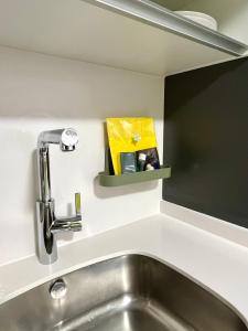 a kitchen with a sink and a faucet at Puente de la Reina de Teruel in Teruel