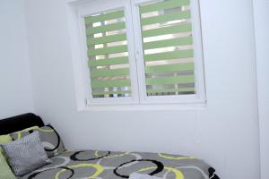 Postel nebo postele na pokoji v ubytování Apartman Oki Doki 1
