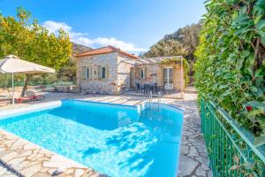 an image of a villa with a swimming pool at Villa Palataki III in Kardamyli
