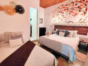 Un pat sau paturi într-o cameră la Hotel Boutique Stay La 10