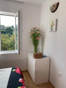 Łóżko lub łóżka w pokoju w obiekcie Apartment Tasha